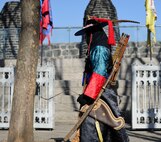 A Bongsugun (beacon tower soldier) stands prepared to begin the tower lighting ceremony at Namsan Beacon Tower Jan. 18, 2014, in Seoul, Republic of Korea. The Beacon Tower served in older times as a means of communication between the provinces of Korea (U.S. Air Force photo by Staff Sgt. Jake Barreiro)
