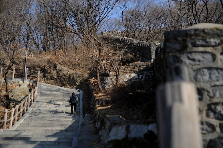 A traveler treks the pathways of Namsan Mountain Jan. 18, 2014, in Seoul, Republic of Korea. The paved walkways and stairs make Namsan Mountain an accessible and family friendly destination for locals and travelers alike. (U.S. Air Force photo by Staff Sgt. Jake Barreiro)