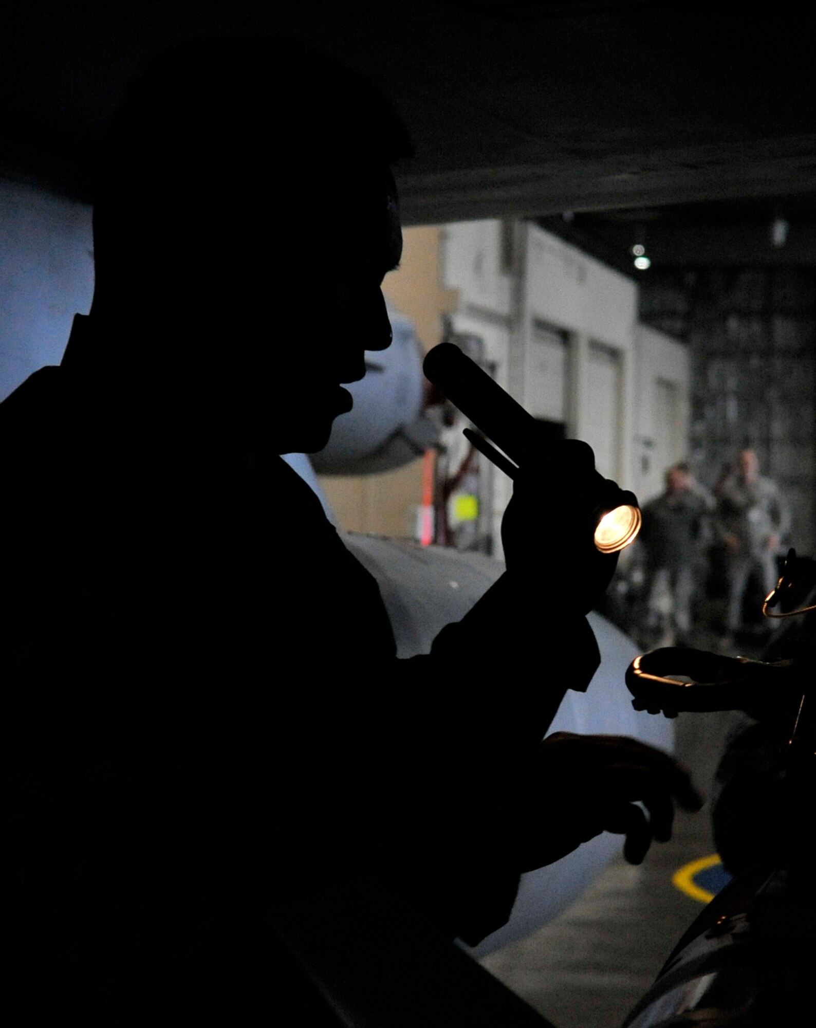 U.S. Air Force Staff Sgt. Gregorio Luis, 14th Aircraft Maintenance Unit weapons load crew member, inspects an armament system during the Weapons Load Crew of the Year competition at Misawa Air Base, Japan, Jan. 17, 2014. The winner of the competition will be announced in March and will represent Misawa at the Pacific Air Forces Load Crew of the Year competition. (U.S. Air Force photo by Airman 1st Class Zachary Kee