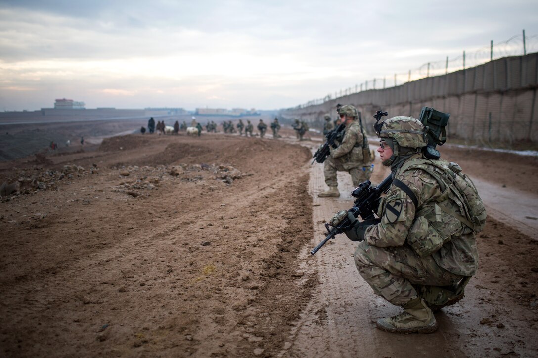 U.S. soldiers patrol around Tarin Kowt, Afghanistan, Jan. 11, 2014.