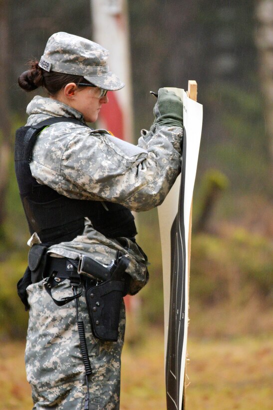 U.S. Army Pvt. Cori Berwanger labels a target with her name during her company's weapons qualification at the 7th Army Joint Multinational Training Command's Grafenwoehr Training Area, Germany, Jan. 13, 2014. Berwanger is assigned to the 615th Military Police Company, 18th Military Police Brigade.