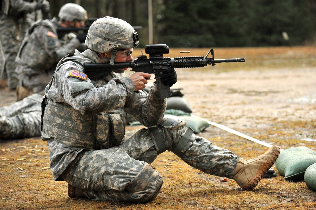 U.S. Army Spc. Joshua Sellers fires his M4 carbine rifle during a weapons qualification at the 7th Army Joint Multinational Training Command's Grafenwoehr Training Area, Germany, Jan. 16, 2014. Sellers is assigned to the 615th Military Police Company, 18th Military Police Brigade.