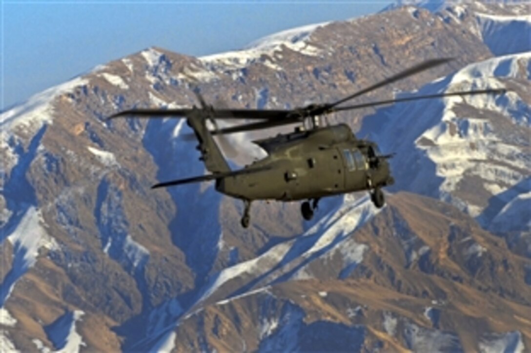 UH-60M Black Hawk helicopter crews conduct a mission to move personnel through Salang Pass in Afghanistan, Jan. 15, 2014. The crews are assigned to the 101st Airborne Division's 159th Combat Aviation Brigade and the 10th Mountain Division's 10th Combat Aviation Brigade. The crews flew the Black Hawk at more than 15,000 feet above sea level as they traveled through the pass.