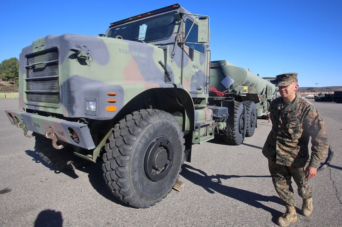 Lance Cpl. Andres Cornejo, a semitrailer refueler operator with General Service Motor Transportation Company, Combat Logistics Regiment 1, 1st Marine Logistics Group, performs quality control checks on the fuel dispensing system of the MK970 refueler as part of the Semitrailer Refueler Operator’s Course aboard Camp Pendleton, Calif., Jan. 15, 2014. Each refueler holds approximately 4,900 gallons of fuel, providing forward Marine Corps units with an increased range of operations in a combat environment or during humanitarian missions by allowing them to travel longer distances and keep utility equipment operating. Cornejo is a native of San Antonio, Texas.