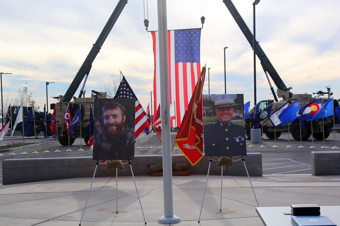 Photos of Staff Sgt. Sky Mote and Capt. Matthew Manoukian, were displayed in front of the 1st Marine Special Operations Battalion headquarters building during a Navy Cross presentation ceremony, held at Camp Pendleton, Calif., Jan. 18, 2014.  Mote and Manoukian were awarded the Navy Cross, posthumously, for their heroic and selfless actions during Operation Enduring Freedom.  