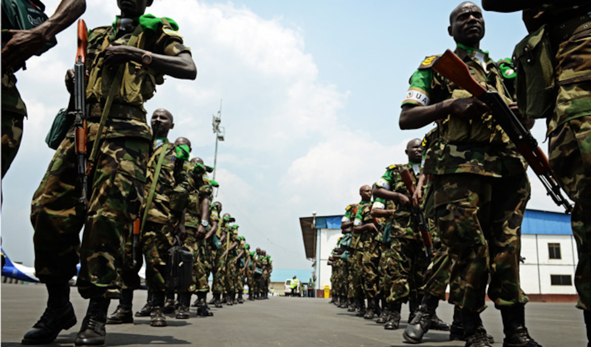 Rwandan soldiers wait in line Jan. 19, 2014, at the Kigali airport to get on a C-17 Globemaster III, based out of McChord Air Force Base, Wash. U.S. forces will transport a total number of 850 Rwandan soldiers and more than 1,000 tons of equipment into the Central African Republic to aid French and African Union operations against militants during this three weeklong operation. (U.S. Air Force photo/Staff Sgt. Ryan Crane)