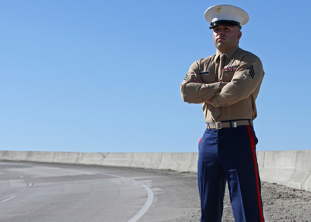 Sgt. Landon Rios, a canvassing recruiter with Recruiting Substation Augusta, Recruiting Station Columbia, stands on a bypass in the city of Augusta, Ga., on Dec. 17. Rios suffered severe injuries following a motorcycle accident at this location on June 20. (Marine Corps Photo by Sgt. Aaron Rooks)