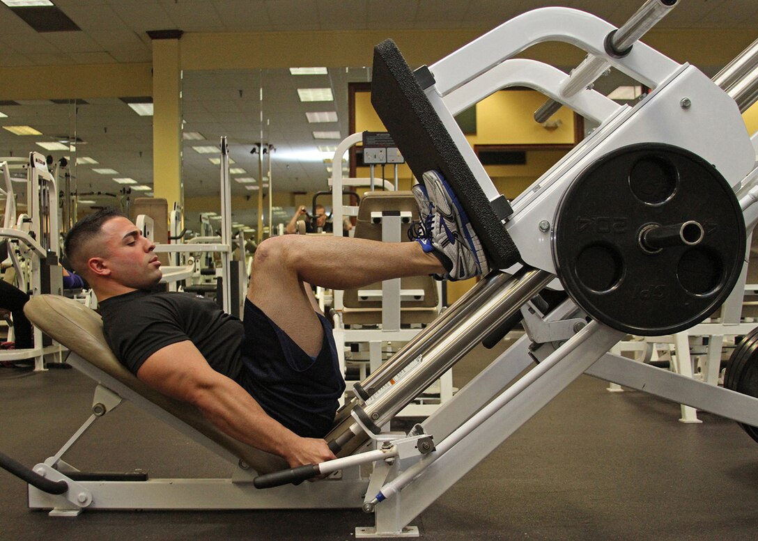 Sgt. Landon Rios, a canvassing recruiter with Recruiting Substation Augusta, Recruiting Station Columbia, performs a leg press exercise at Gold’s Gym on Dec. 17 in Augusta, Ga. Rios required emergency knee surgery following a motorcycle accident at this location on June 20. (Marine Corps Photo by Sgt. Aaron Rooks)