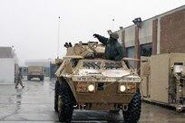 Guard Soldier in Washington, D.C., prepares a vehicle in case it is needed for snow operations prior to the storm that hit the region Jan. 21, 2014.