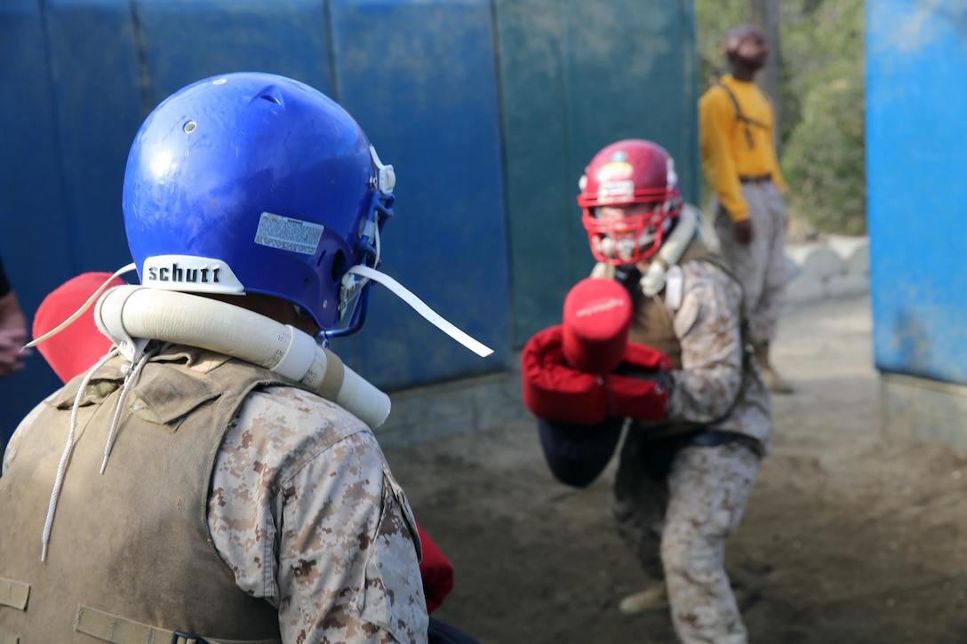 Recruits of Company F, 2nd Recruit Training Battalion, square up to fight during the Pugil Sticks III event aboard the depot, Jan. 7. Each recruit received a helmet, flak jacket, groin protector, mouth guard and a pugil stick with hand protectors to ensure saftey during each bout.