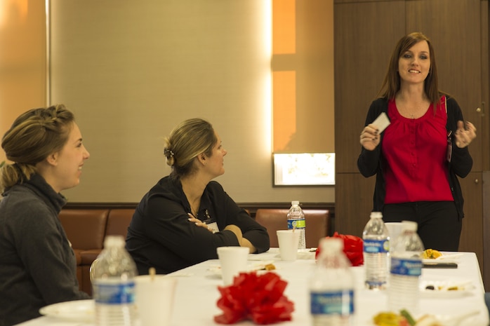 Jennifer Carr, Lifestyle Insight Networking Knowledge and Skills trainer, plays a game to help spouses get to know each other during a L.I.N.K.S Meet and Greet. The event helped spouses get acquainted with one another Jan. 22, 2014, aboard Marine Corps Air Station Iwakuni, Japan. Lifestyle Insight Networking Knowledge and Skills has a flexible agenda to accommodate for spouses with various schedules.   