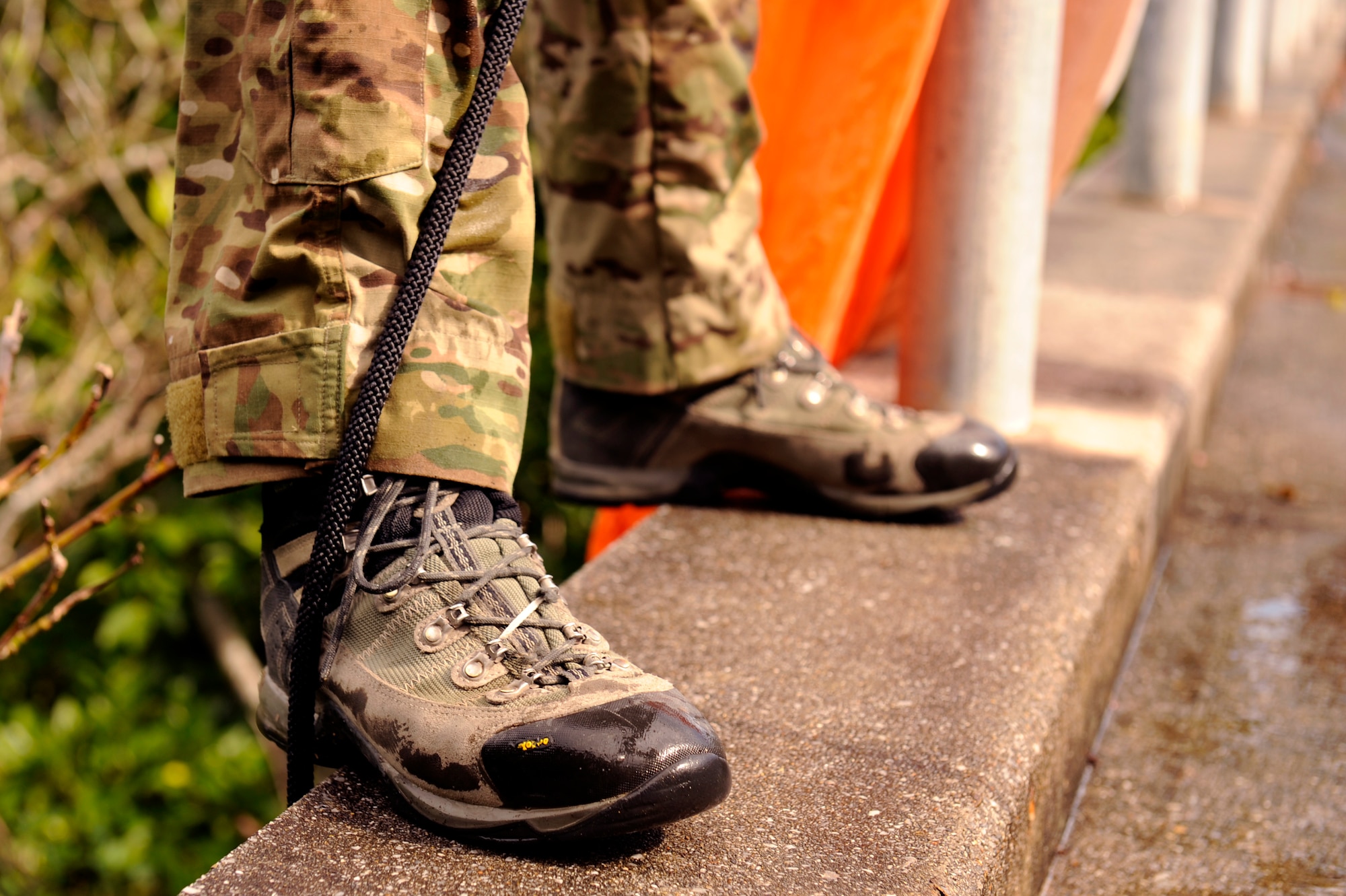 U.S. Air Force Staff Sgt. Joshua Cunningham, 31st Rescue Squadron pararescueman, prepares to rappel from a bridge to save a simulated parachute catch victim during element leader upgrade training on Kadena Air Base, Japan, Jan. 22, 2014. In order for a pararescueman to become an element leader, the individual must complete several rescue-related tasks and challenges. (U.S. Air Force photo by Senior Airman Maeson L. Elleman)