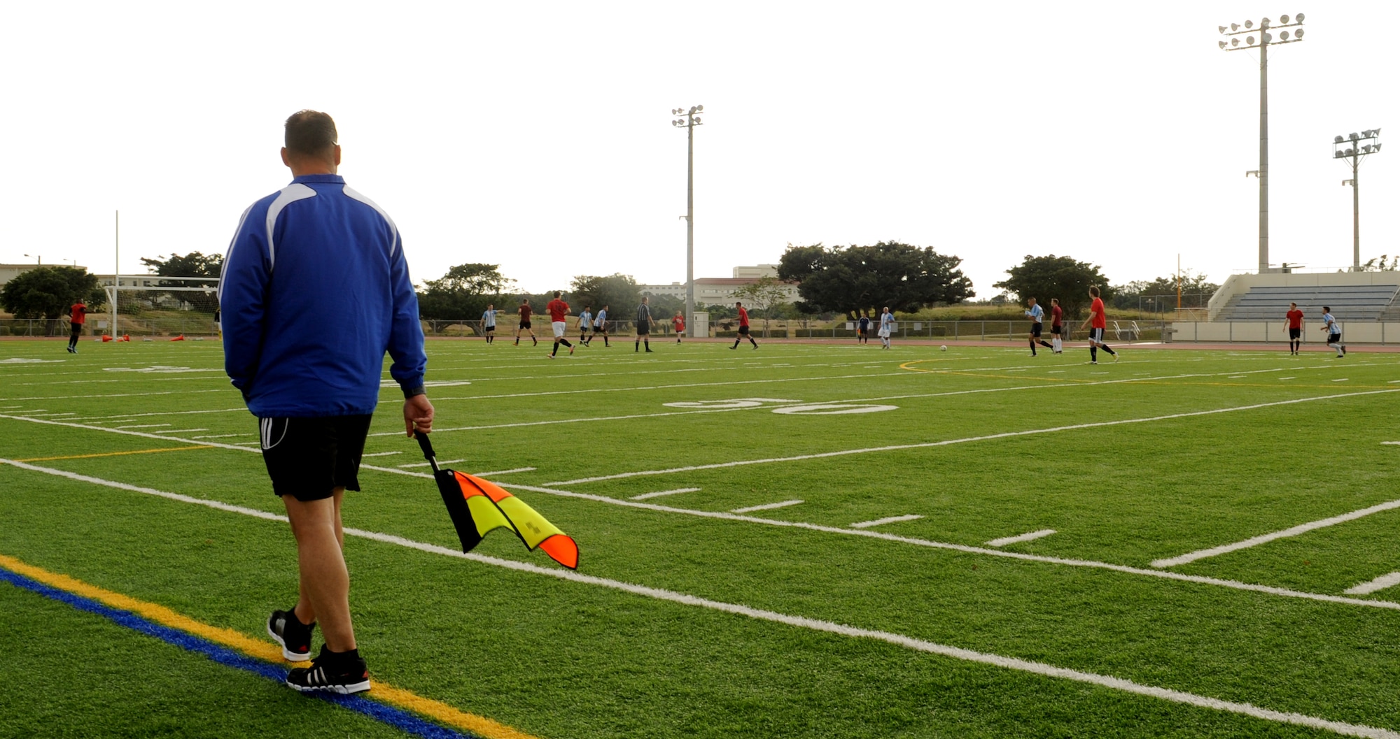 U.S. Air Force Tech. Sgt. Sean Donovan, 718th Aircraft Maintenance Squadron aircraft propulsions systems, oversees a playoff soccer game on Kadena Air Base, Japan, Jan. 12, 2014. Members from various units formed teams and participated in the 2013 soccer intramural league, after being informed of its cancellation. (U.S. Air Force photo by Airman 1st Class Keith James)