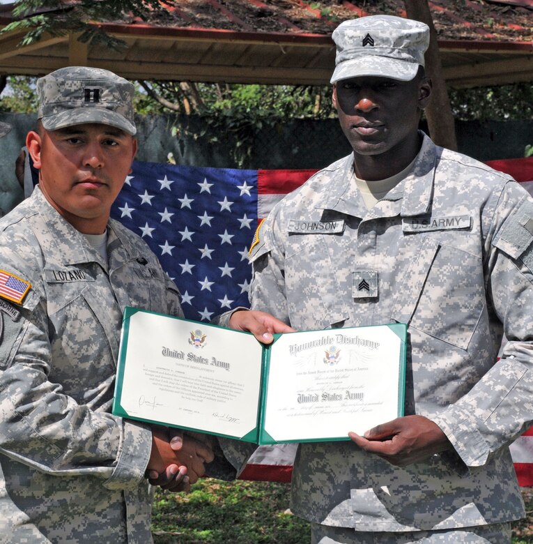 Sgt. Quaterius Johnson and Spc. Robert Daugherty re-enlisted in the United States Army during a ceremony conducted at Soto Cano Air Base, Honduras, January 22. Both Johnson and Daugherty are members of Army Forces Batallion, Joint Task Force-Bravo.
