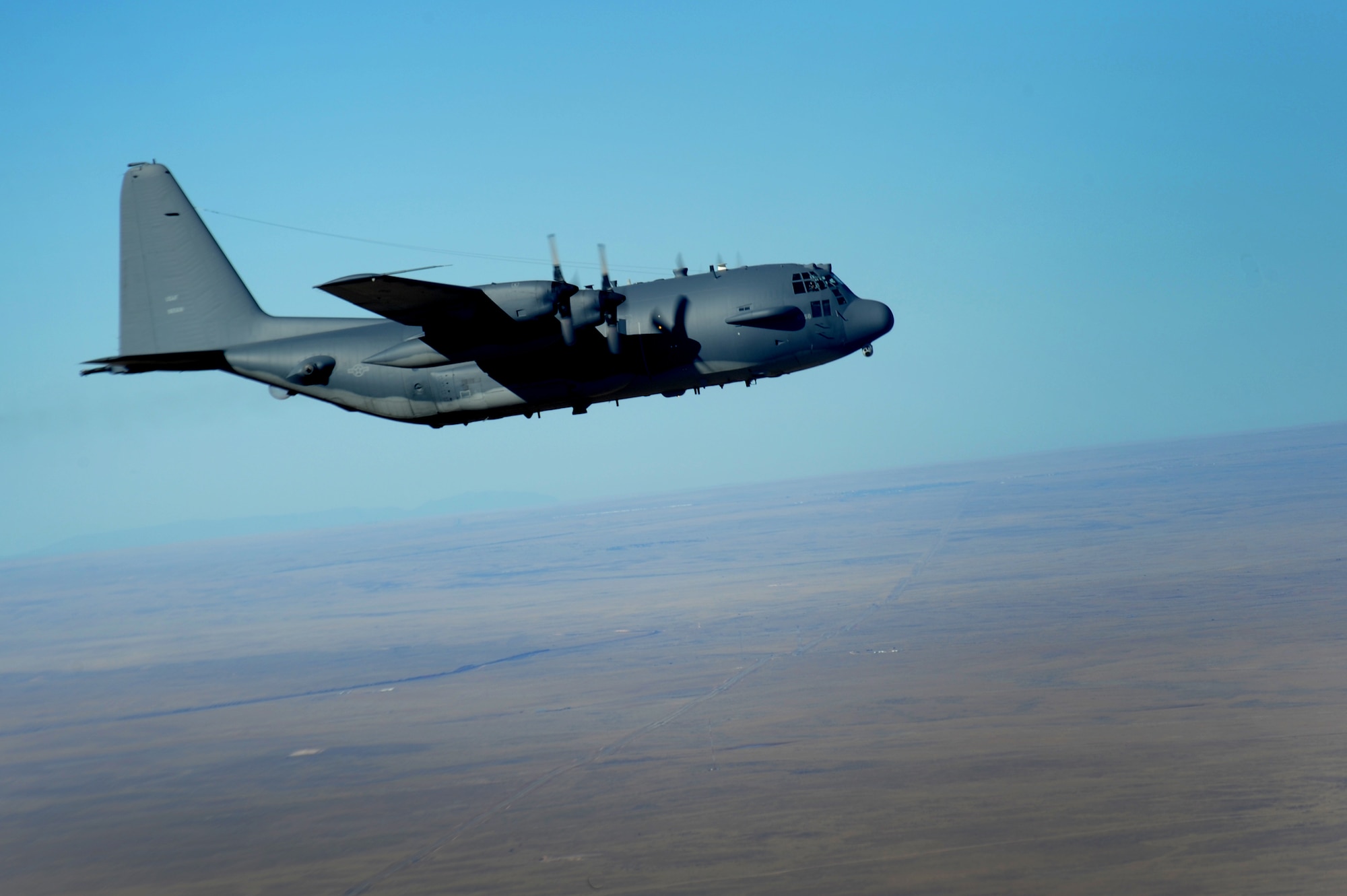 An AC-130H Spectre gunship navigates the skies above Eastern New Mexico during the final AC-130H mission conducted at Cannon Air Force Base, N.M., Jan. 16. The C-130 began its operational service with the Air Force in 1956 and AC-130 development began in the early 1960s.(U.S. Air Force photo/Senior Airman Xavier Lockley)