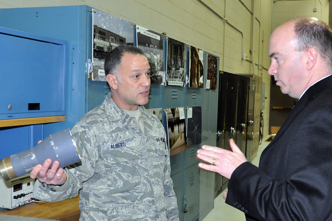 YOUNGSTOWN AIR RESERVE STATION, Ohio – The mayor’s visit to YARS concluded with a guided tour of the wing’s one-of-a-kind mission. Air Force Reserve Senior Master Sgt. Phil Aliberti, 910th Aerial Spray Maintenance Chief, shows one of the nozzles used  in the wing’s aerial spray missions to Mayor John McNally (left), of the nearby City of Youngstown, at the Aerial Spray Facility here during an installation visit, Jan. 17, 2014. The nozzle Sergeant Aliberti is holding is part of the Modular Aerial Spray System (MASS). The MASS is used to carry out the unit’s unique capability. The 910th Airlift Wing is home to the Department of Defense’s only aerial spray squadron. The mayor visited YARS to learn more about the wing’s mission and the installation’s features firsthand as well as meet some of the Citizen Airmen assigned here. 