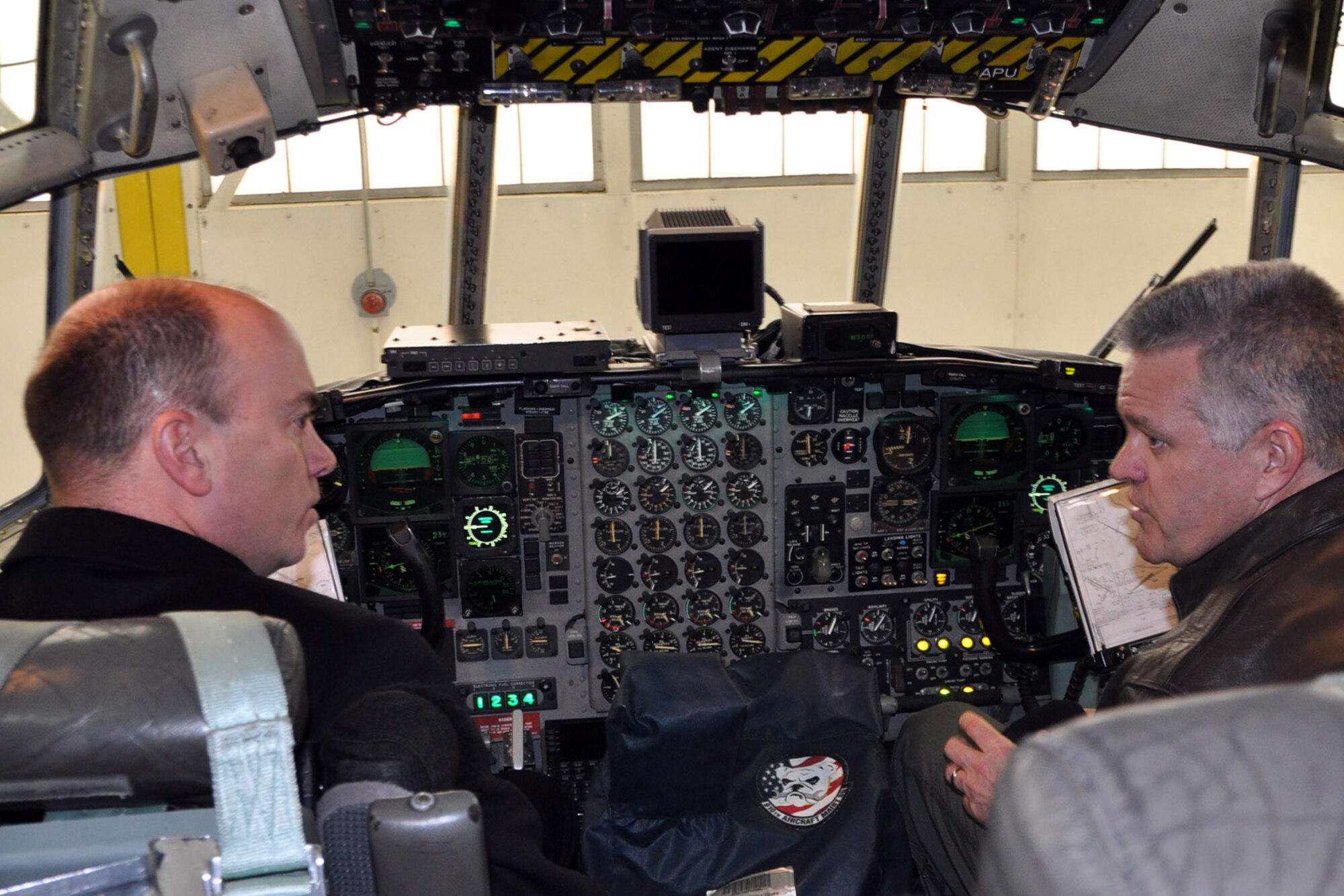 YOUNGSTOWN AIR RESERVE STATION, Ohio – Following a tour of the maintenance hangar, the mayor had the opportunity to get an up close and personal view of one of the wing’s assigned cargo aircraft. Air Force Reserve Lt. Col. Don Richey (right), deputy commander of the 910th Operations Group, based here, talks with Mayor John McNally (left), of the nearby City of Youngstown,  about aircraft capabilities on the flight deck of a C-130 Hercules cargo aircraft in a hangar here, Jan. 17, 2014. The mayor visited YARS to learn more about the wing’s capabilities and the installation’s features firsthand as well as meet some of the Citizen Airmen assigned here. 
