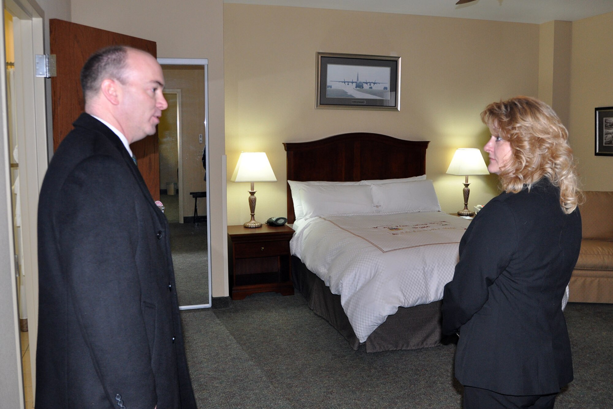 YOUNGSTOWN AIR RESERVE STATION, Ohio – Mayor John McNally, of the nearby City of Youngstown, talks about facilities amenities with Air Force Reserve 910th Lodging Manager Cheryl Taylor in one of the Eagle’s Nest Lodge’s Distinguished Visitor suites here, Jan. 17, 2014. Following a group meal at the adjacent YARS Community Activity Center, Mayor McNally continued his installation visit with a tour of the 123-room Eagle’s Nest Lodge. The tour of the lodging facility was guided by 910th Mission Support Group commander Teresa Hams, 910th Chief of Services Nancy Rubino and Ms. Taylor. The mayor visited YARS to learn more about the wing’s capabilities and the installation’s features firsthand as well as meet some of the Citizen Airmen assigned here.