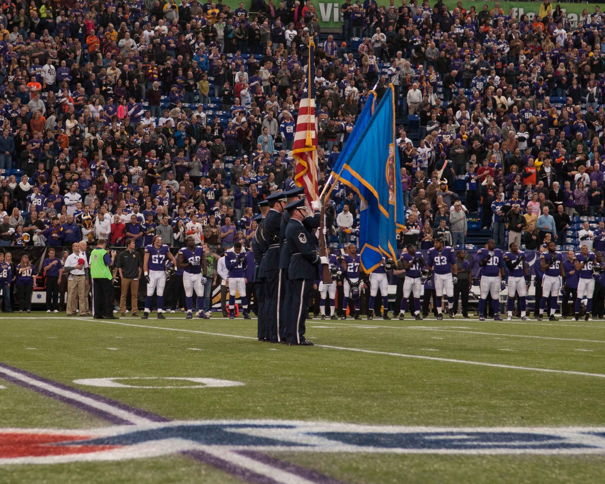 The 133rd Airlift Wing’s base honor guard posts the colors at the Minnesota Vikings verses the Chicago Bears game at Mall America Field in Minneapolis, Minn., Dec. 1, 2013.

(U.S. Air National Guard photo by Tech. Sgt. Amy M. Lovgren/Released) 
