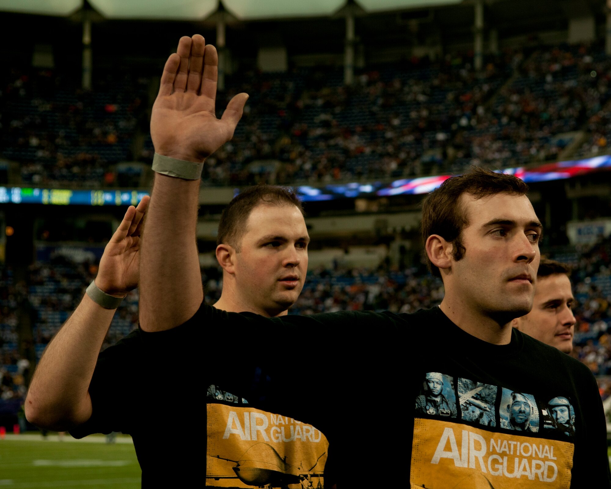 New recruits from the 133rd Airlift Wing recite the oath of enlistment before the Minnesota Vikings verses the Chicago Bears game at Mall America Field in Minneapolis, Minn., Dec. 1, 2013. Most of the Airmen will be leaving for basic military training where they will train and develop into the next generation of Airmen to serve in the world’s greatest Air Force.

 (U.S. Air National Guard photo by Tech. Sgt. Amy M. Lovgren/Released) 

