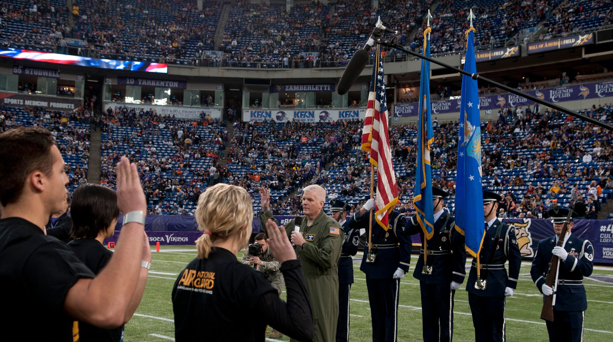 Col. Jim Johnson, 133rd Airlift Wing Commander, administers the oath of enlistment to new recruits at the Mall of America Field in Minneapolis, Minn., Dec. 1, 2013. Most of these recruits are coming out of high school, college, or the work force and now will be taking on their new roles within the wing.  
(U.S. Air National Guard photo by Tech. Sgt. Amy M. Lovgren/Released)
