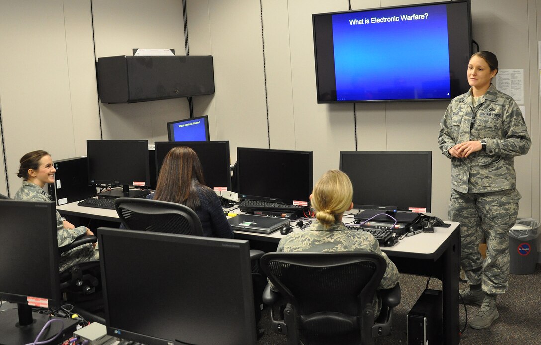 Staff Sgt. Latisha Taylor, 39th Information Operations Squadron instructor, teaches a class about electronic warfare at Hurlburt Field, Fla., Dec. 16, 2013. More than 1,000 students train at the 39th IOS annually. (U.S. Air Force photo/Capt. Casey Osborne)