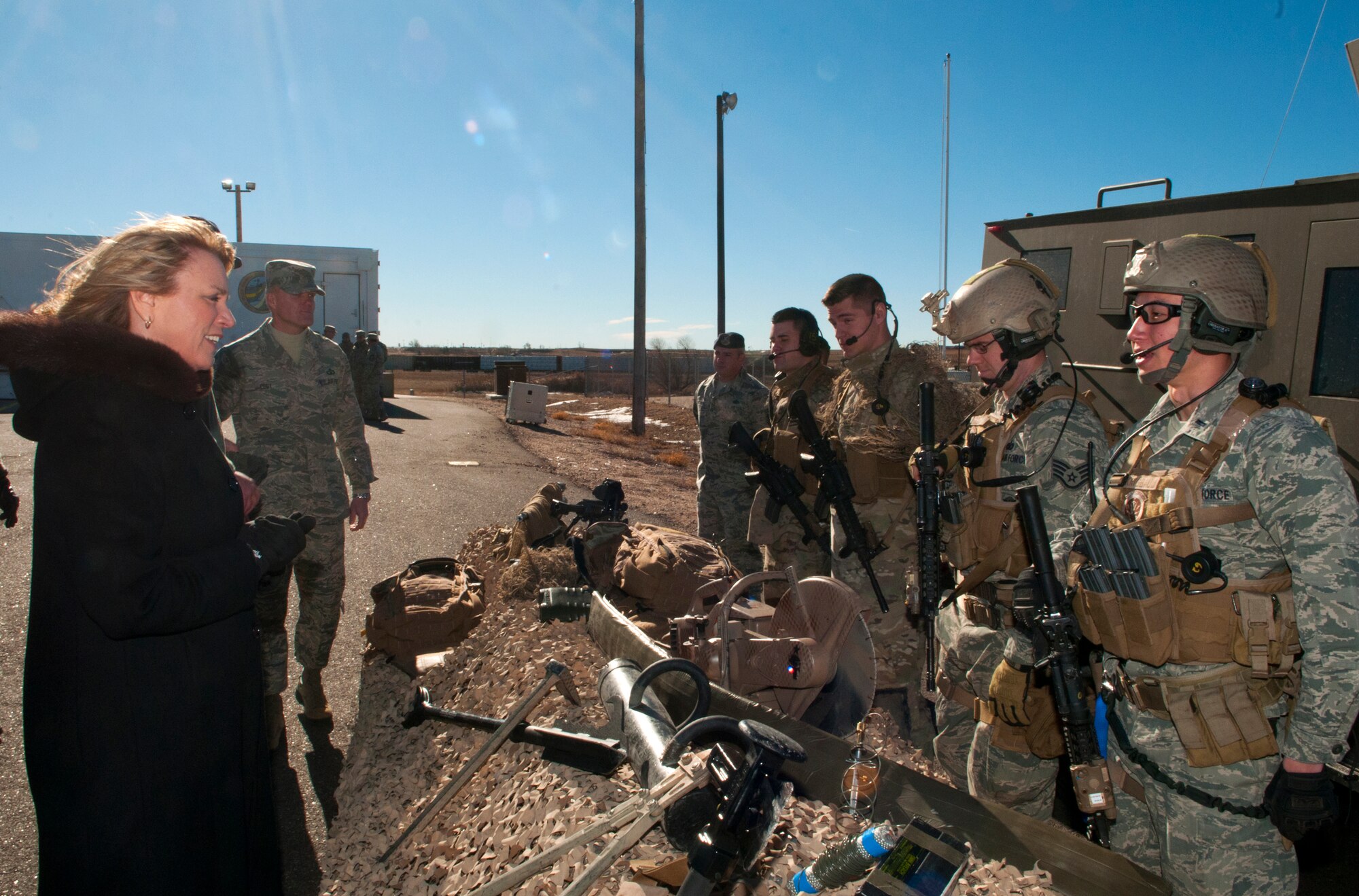 140121-F-JW079-217 Secretary of the Air Force Deborah Lee James listens as 1st Lt. David Krigbaum, 90th Security Forces Tactical Response Force, explains the TRF mission of defending the nation’s nuclear assets against any hostile threat Jan. 21, 2014. James and Chief Master Sgt. of the Air Force James Cody, background, visited the 20th Air Force and 90th Missile Wing on F.E. Warren Air Force Base, Wyo., to learn about the Minuteman III weapon system and the Airmen who operate, maintain, secure and support it. (U.S. Air Force photo by R.J. Oriez)