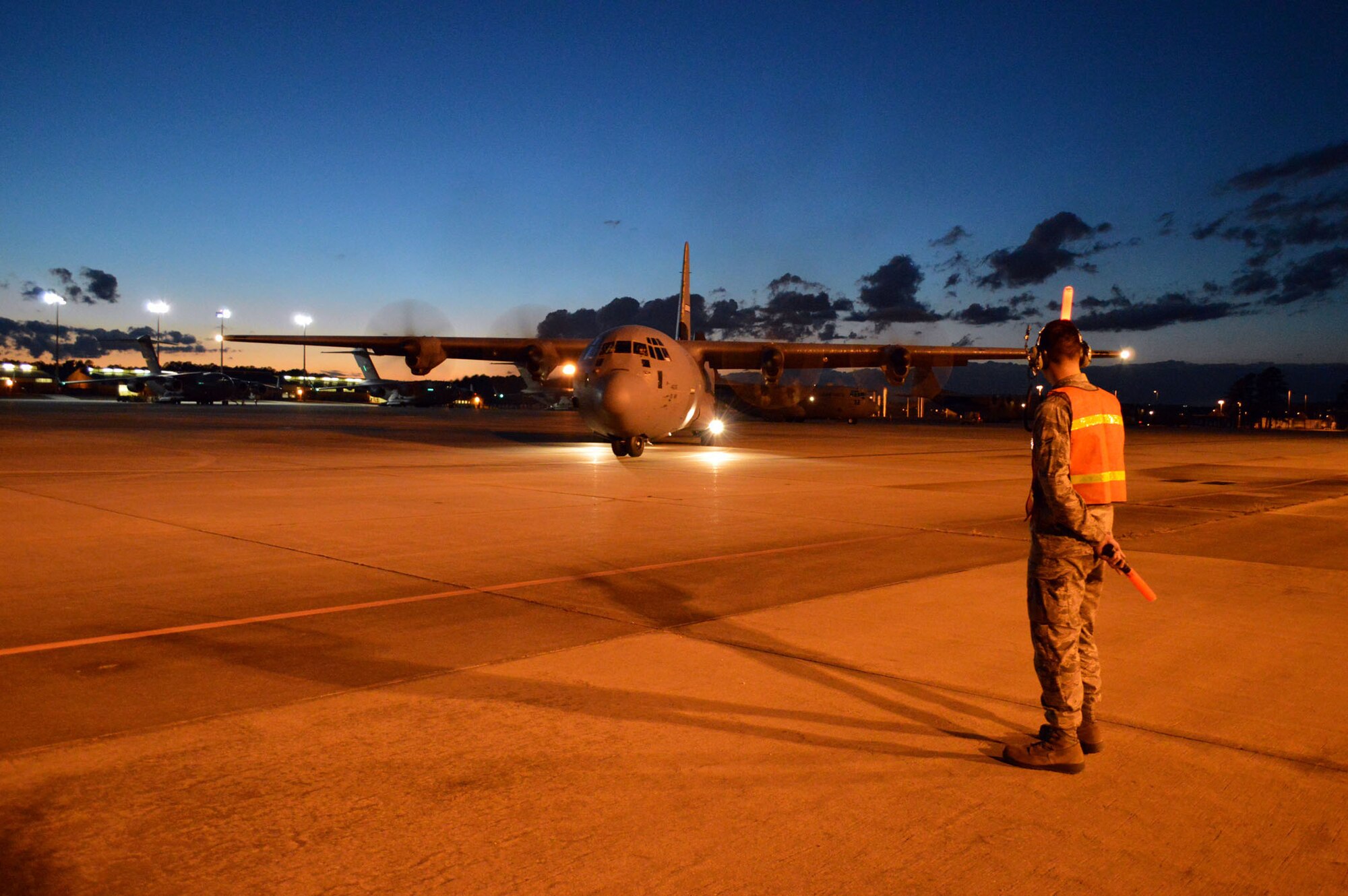 An Air Force C-130 Hercules aircraft taxis on Green Ramp during joint exercise Global Response Expeditor on Jan. 15, 2014, at Pope Army Airfield, Fort Bragg, N.C. The purpose of this exercise was to prepare United States Transportation Command units, Air Mobility Command forces and elements of the XVIII Airborne Corps to respond as part of the Global Response Force and to conduct Joint Forcible Entry operations. This exercise executed Joint Forcible Entry operations in support of a combined Joint Task Force utilizing drop zones at the Joint Readiness Training Center, Fort Polk, La. Air mobility aircraft and crews airdropped approximately 1,124 paratroopers and offloaded more than 120 short tons of cargo. (U.S. Air Force photo/Marvin Krause)