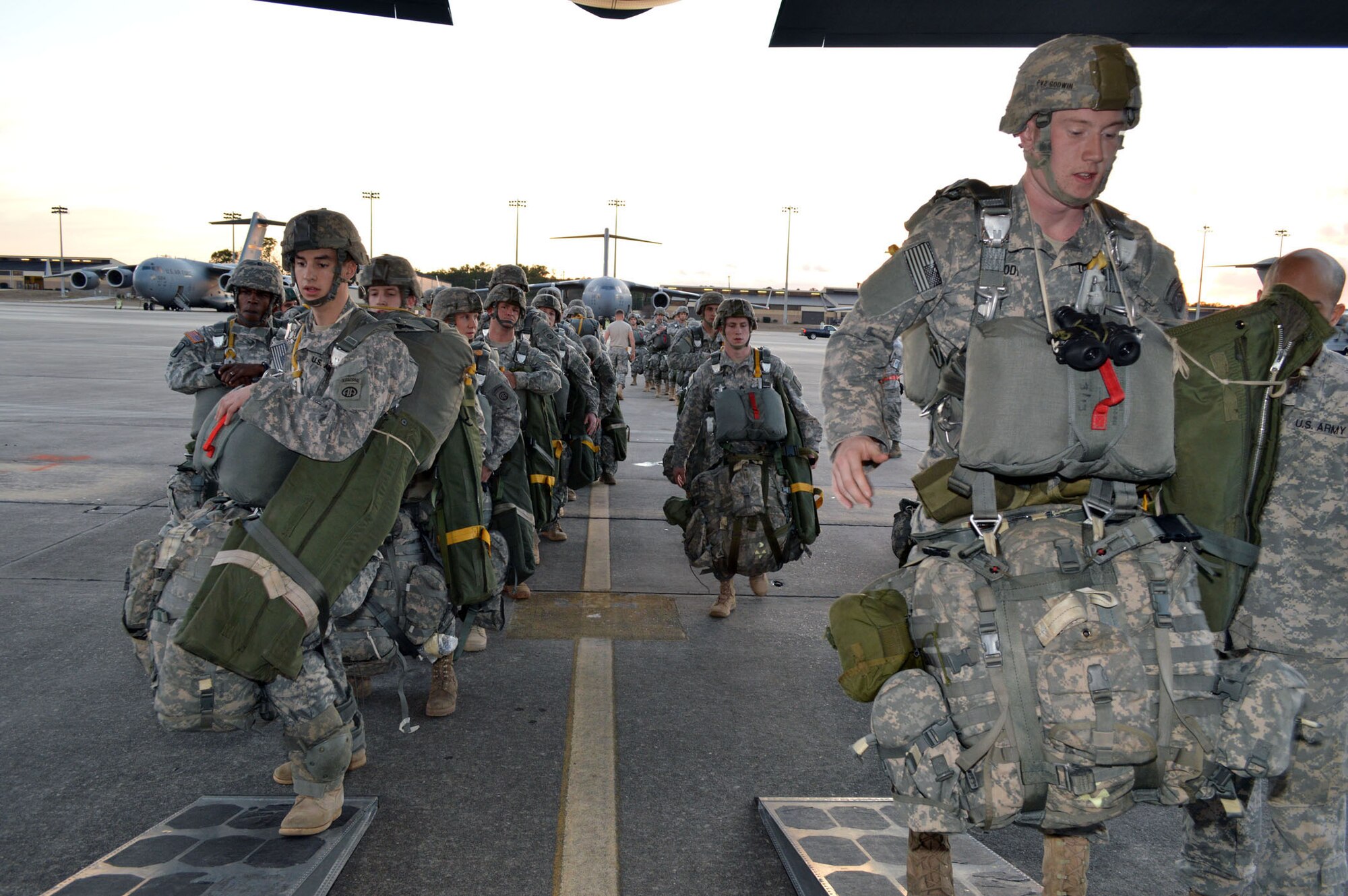 Army paratroopers from the 82nd Airborne Division load onto Air Force C-130 Hercules aircraft during joint exercise Global Response Expeditor on Jan. 15, 2014, at Pope Army Airfield, Fort Bragg, N.C. The purpose of this exercise was to prepare United States Transportation Command units, Air Mobility Command forces and elements of the XVIII Airborne Corps to respond as part of the Global Response Force and to conduct Joint Forcible Entry operations. This exercise executed Joint Forcible Entry operations in support of a combined Joint Task Force utilizing drop zones at the Joint Readiness Training Center, Fort Polk, La. Air mobility aircraft and crews airdropped approximately 1,124 paratroopers and offloaded more than 120 short tons of cargo. (U.S. Air Force photo/Marvin Krause)