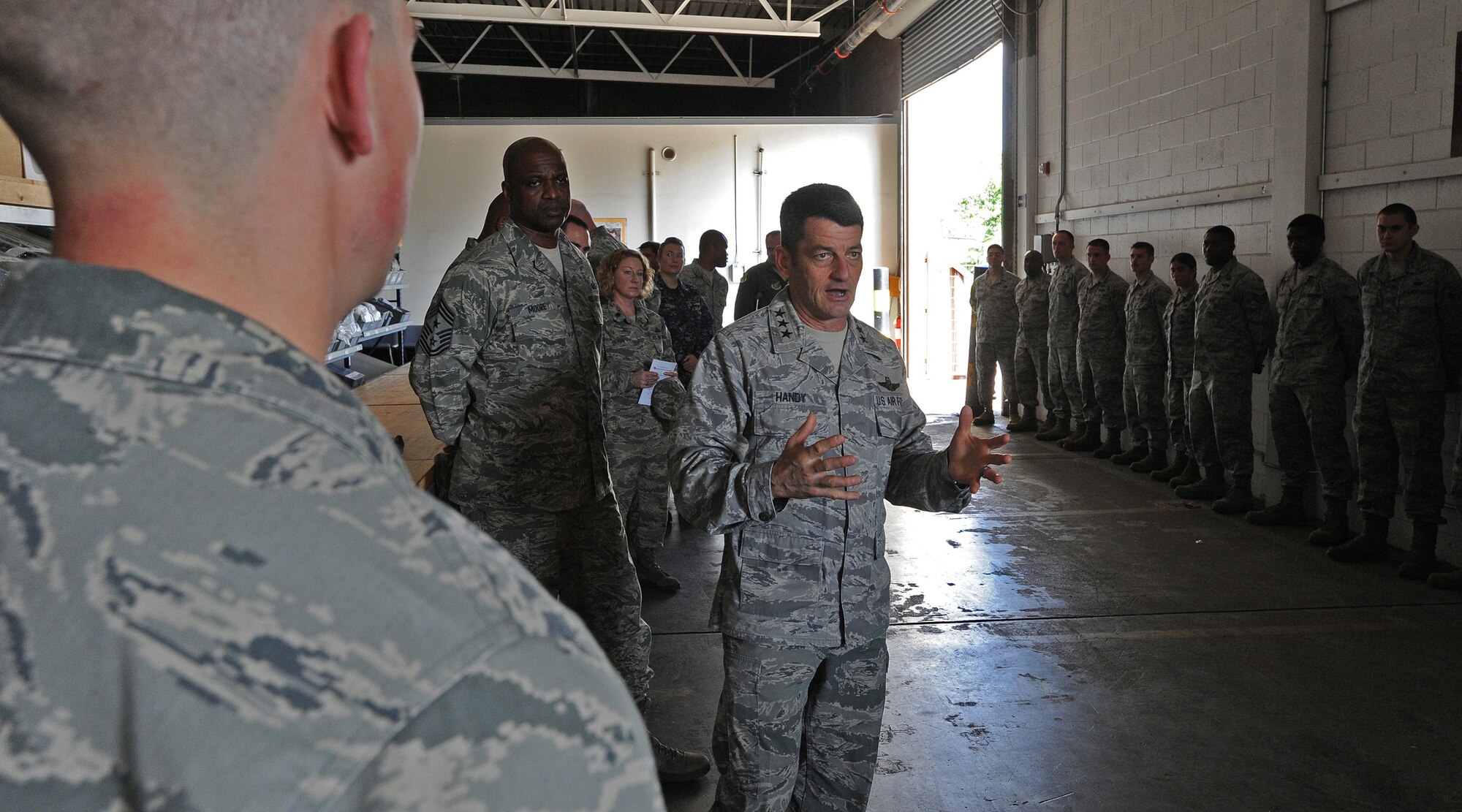 Lt. Gen. Russell Handy, 11th Air Force commander, addresses Airmen from the 647th Logistics Readiness Squadron at the Personnel Deployment Function building during a familiarization tour at Joint Base Pearl Harbor-Hickam, Hawaii, Jan. 21, 2014. Handy assumed command of the 11th AF in August 2013. (U.S. Air Force photo/Master Sgt. Jerome S. Tayborn)