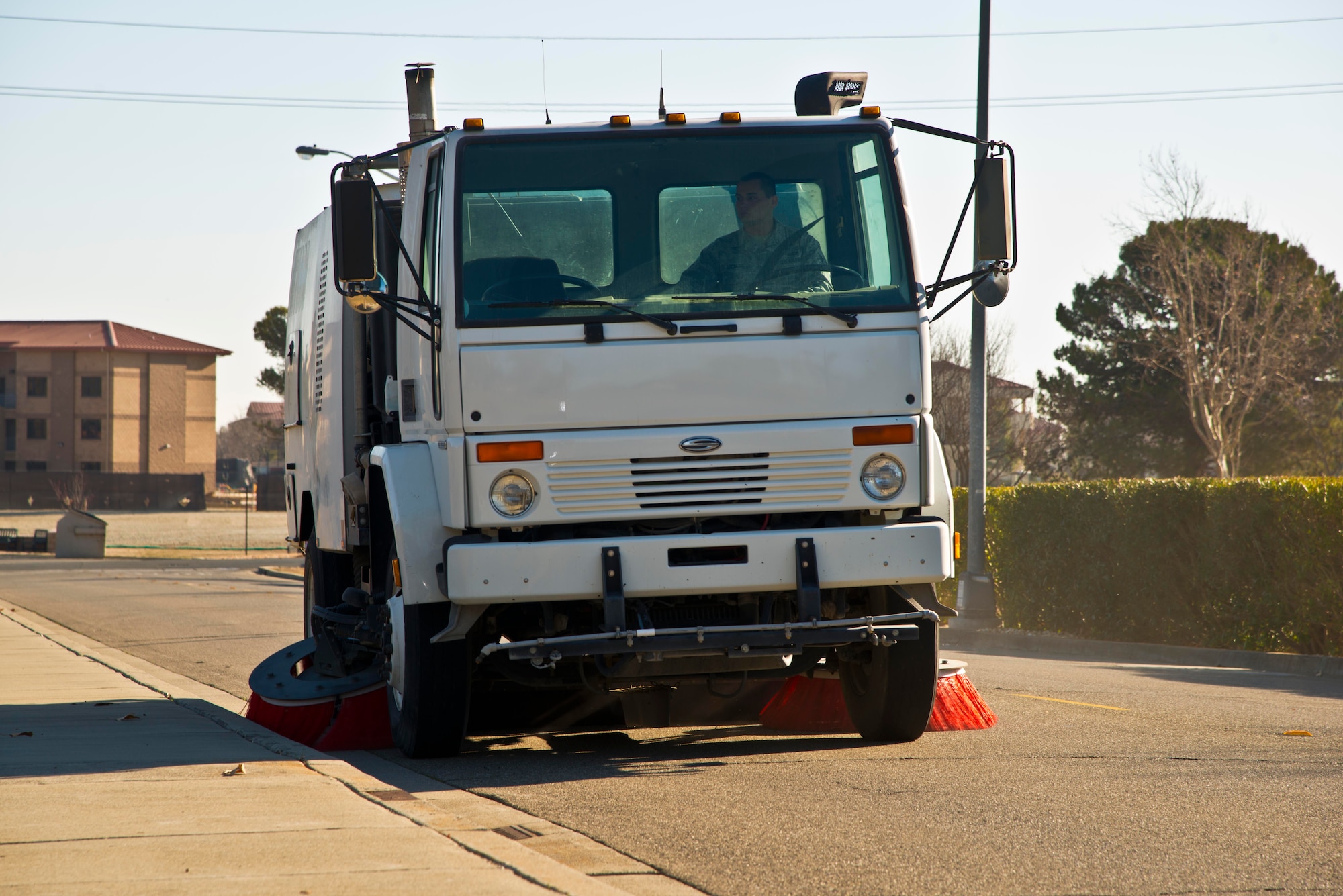 A street sweeper cleans the streets Tuesday. The 60th CES pavement and
equipment shop collects approximately seven cubic yards of debris daily and
approximately seven tons yearly.(U.S. Air Force photo/Senior Airman Nicole Leidholm)