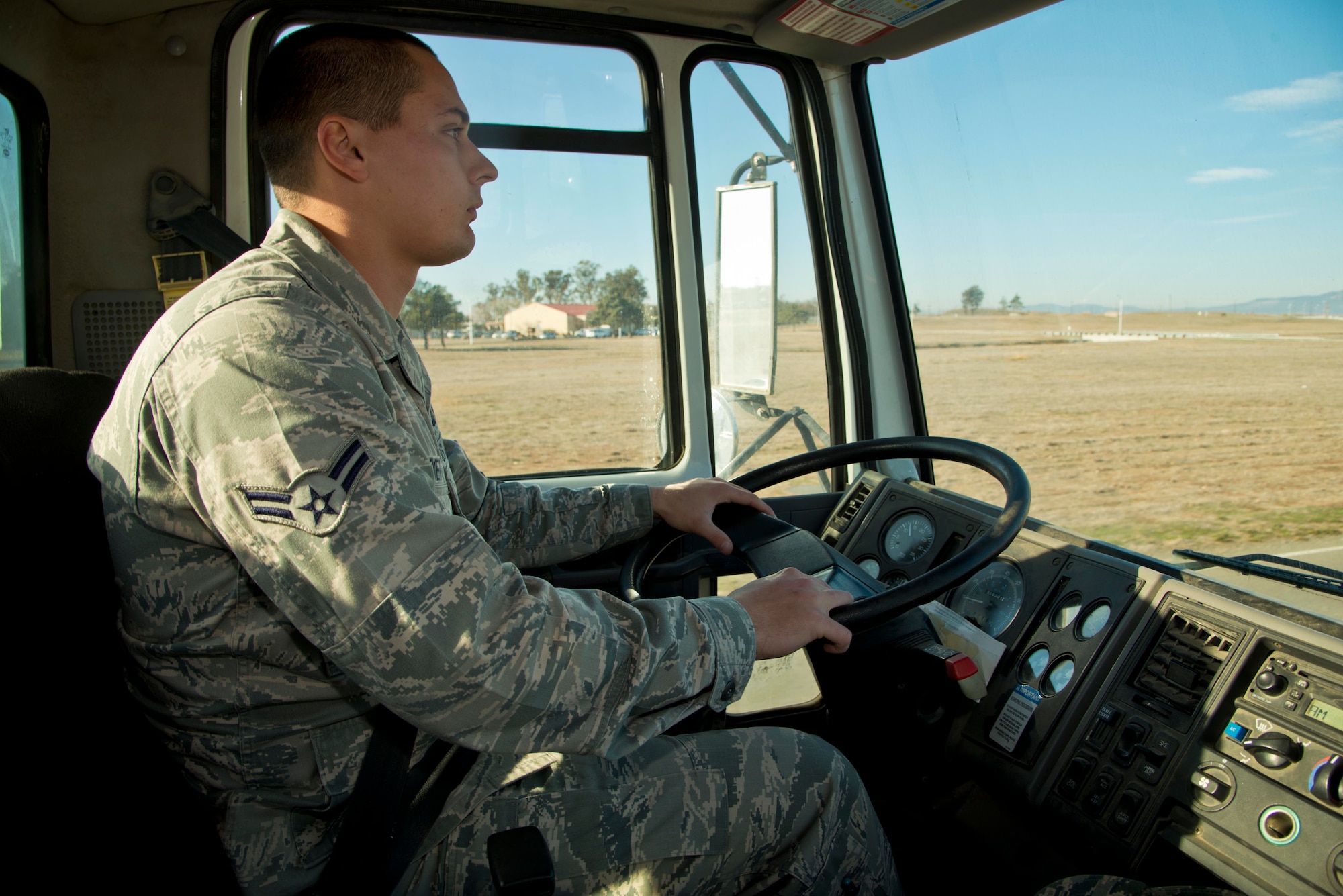 Airman 1st Class Frank Lockett, 60th Civil Engineer Squadron pavement and
equipment specialist, drives a street sweeper near the flightline Tuesday.
Even a tiny rock can pose a serious threat if caught inside the engine of a
C-5 Galaxy, C-17 Globemaster III or KC-10 Extender.(U.S. Air Force photo/Senior Airman Nicole Leidholm)