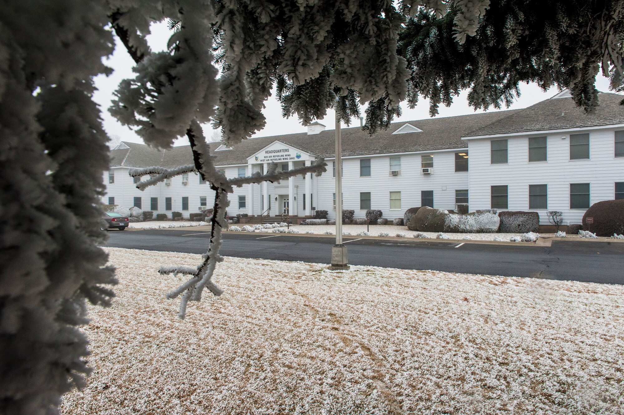 Winter weather has taken on a new meaning at Fairchild Air Force Base, Wash., with random ice storms and thick fog leading the way to air stagnation and an array of other issues across the valley. Pictured here is the 92nd and 141st Air Refueling Wing headquarters building, known as “The White House.” (U.S. Air Force photo by Staff Sgt. Benjamin W. Stratton/Released)