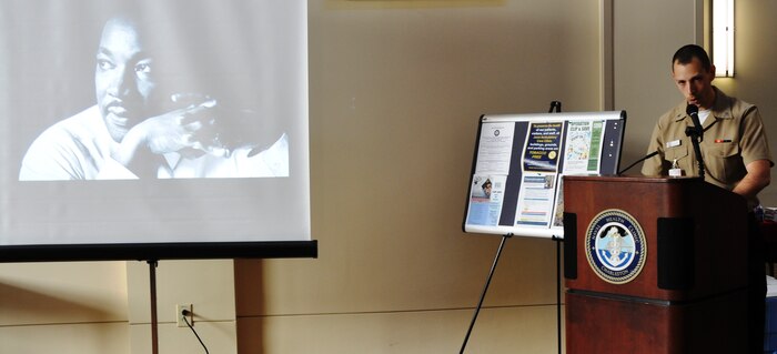 Hospitalman Patrick Collier, Naval Health Clinic Charleston X-ray technician, speaks at NHCC's Martin Luther King Jr. celebration Jan. 17, 2014, at NHCC on Joint Base Charleston – Weapons Station, S.C. Collier was one of three Sailors who shared stories about acceptance, overcoming adversity and how King's, "I have a dream" speech impacted their lives. (U.S. Navy photo/Kris Patterson)