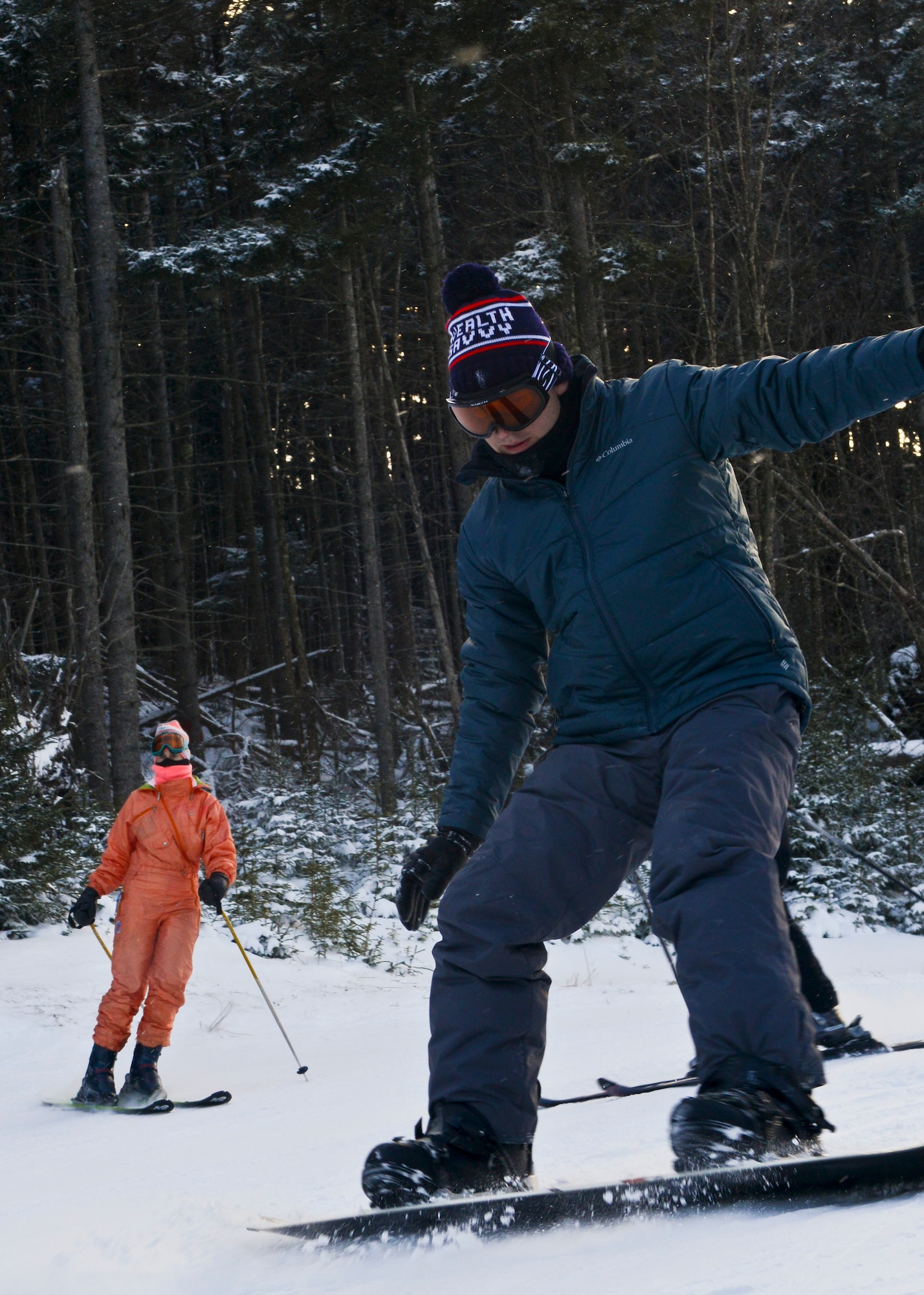 Skiers and snowboarders make their way down trails while on the Single Airman Initiative trip to Snowshoe Mountain Ski Resort in Snowshoe, W.Va. Jan. 18, 2014. Participants enjoyed skiing, snowboarding, snow tubing, off-road snowmobiling and resort restaurants. (U.S. Air Force photo illustration by Airman 1st Class Victoria H. Taylor/Released)