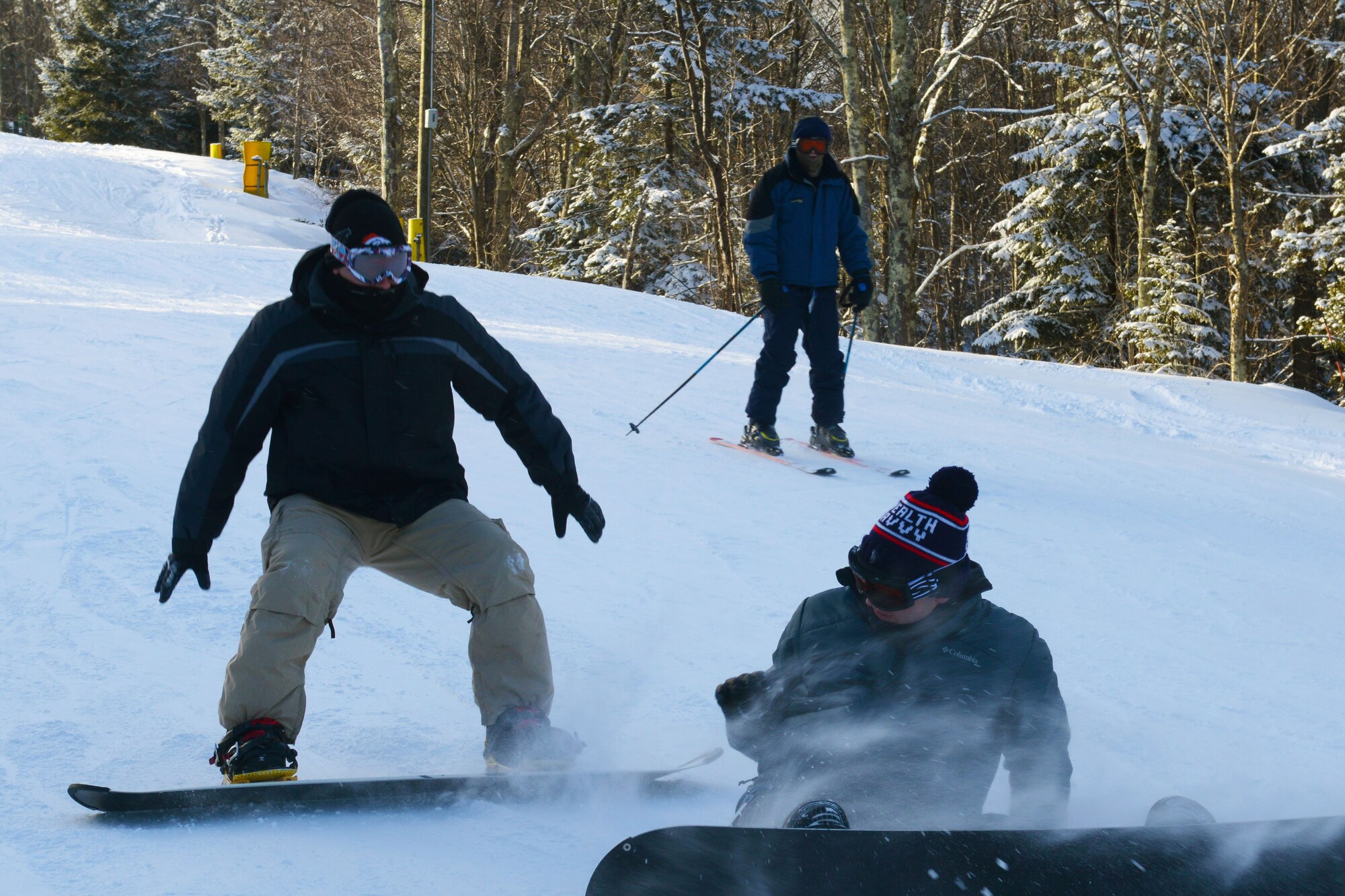 Service members on the Single Airmen Initiative “Ski trip to Snowshoe Mountain” snowboard and ski down trails at Snowshoe Mountain Ski Resort in Snowshoe, W.Va., Jan. 18, 2014. The SAI partnered with the 633rd Force Support Squadron Outdoor Recreation to host nearly 50 Airmen and their families on its first trip of the year. (U.S. Air Force photo by Airman 1st Class Victoria H. Taylor/Released)