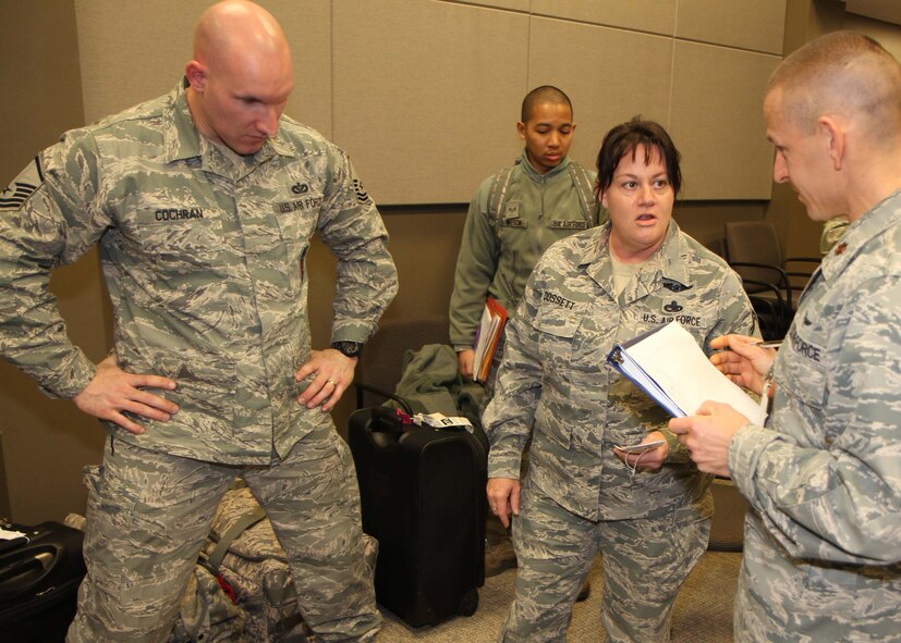 Maj. Bob Atkins, checks off a list of items as he supports the mission as a 932nd Airlift Wing inspector, and looks through mobility bags during a recent practice event at the Illinois unit near Belleville.  (U.S. Air Force photo/Tech. Sgt. Chris Parr)
