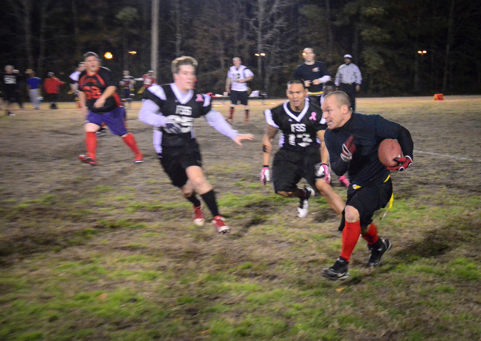 Ryan Mathesius, 628th Civil Engineer Squadron running back, gains yards after a catch during the Intramural Flag Football Championship game at Joint Base Charleston – Air Base, S.C., Jan. 17, 2014. CES beat the 628th Force Support Squadron 13-12 to win back-to-back championships. (U.S. Air Force photo/Staff Sgt. William O’Brien)