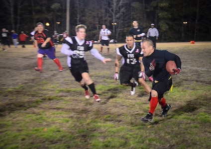 Ryan Mathesius, 628th Civil Engineer Squadron running back, gains yards after a catch during the Intramural Flag Football Championship game at Joint Base Charleston – Air Base, S.C., Jan. 17, 2014. CES beat the 628th Force Support Squadron 13-12 to win back-to-back championships. (U.S. Air Force photo/Staff Sgt. William O’Brien)