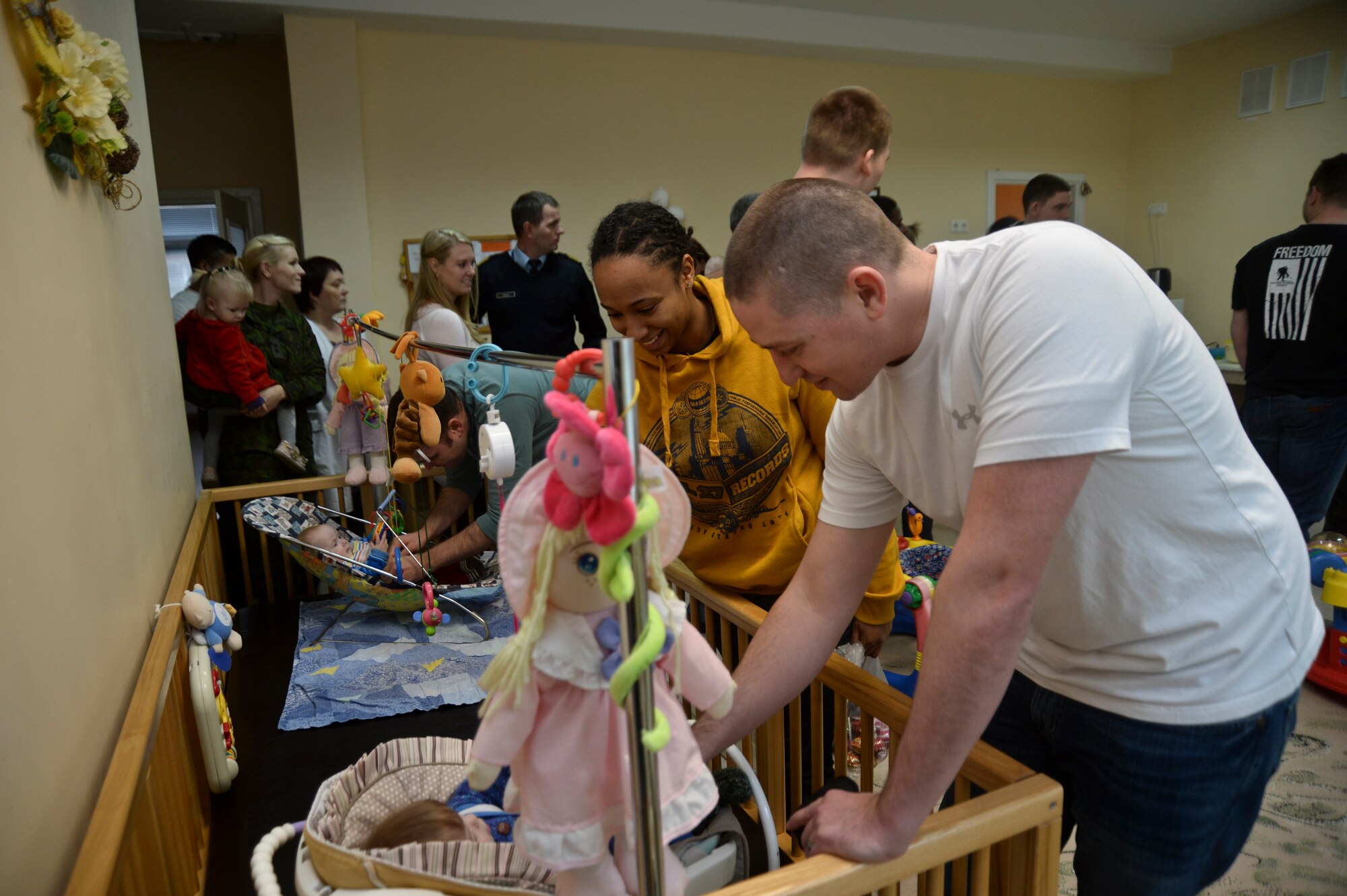 Airmen visit children at the Šiauliai City Baby’s Orphanage in Lithuania, Jan. 9, 2014. Airmen volunteered during the NATO Baltic Air Policing mission to give back to the host community. (U.S. Air Force photo by Airman 1st Class Nigel Sandridge/Released)