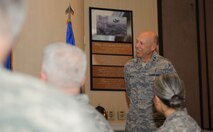 Chaplain (Maj. Gen.) Howard Stendahl, U.S. Air Force chief of chaplains, listens to Wolf Pack Airmen give thanks for his message during the National Prayer Breakfast at Kunsan Air Base, Republic of Korea, Jan. 21, 2014. Stendahl spoke as the guest speaker during the annual National Prayer Breakfast with Kunsan being one of two NPBs that he is able to attend. (U.S. Air Force photo by Senior Airman Armando A. Schwier-Morales/Released)