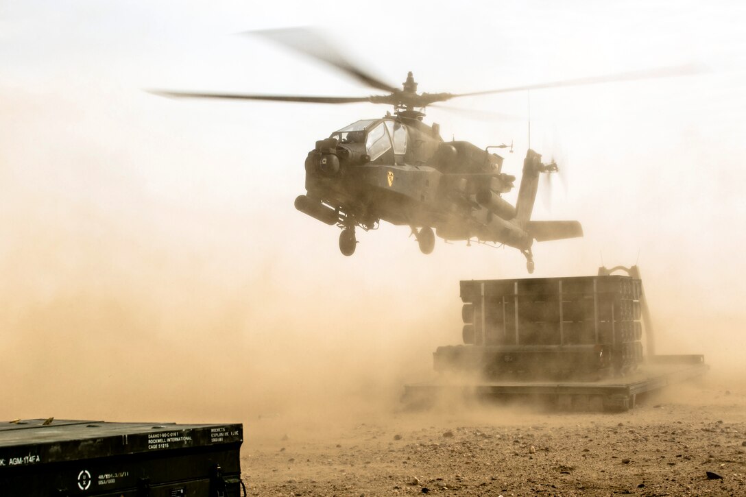 A U.S. Army AH-64 Apache helicopter lands during a forward arming and refueling point exercise near Camp Buehring, Kuwait, Jan. 15, 2014.