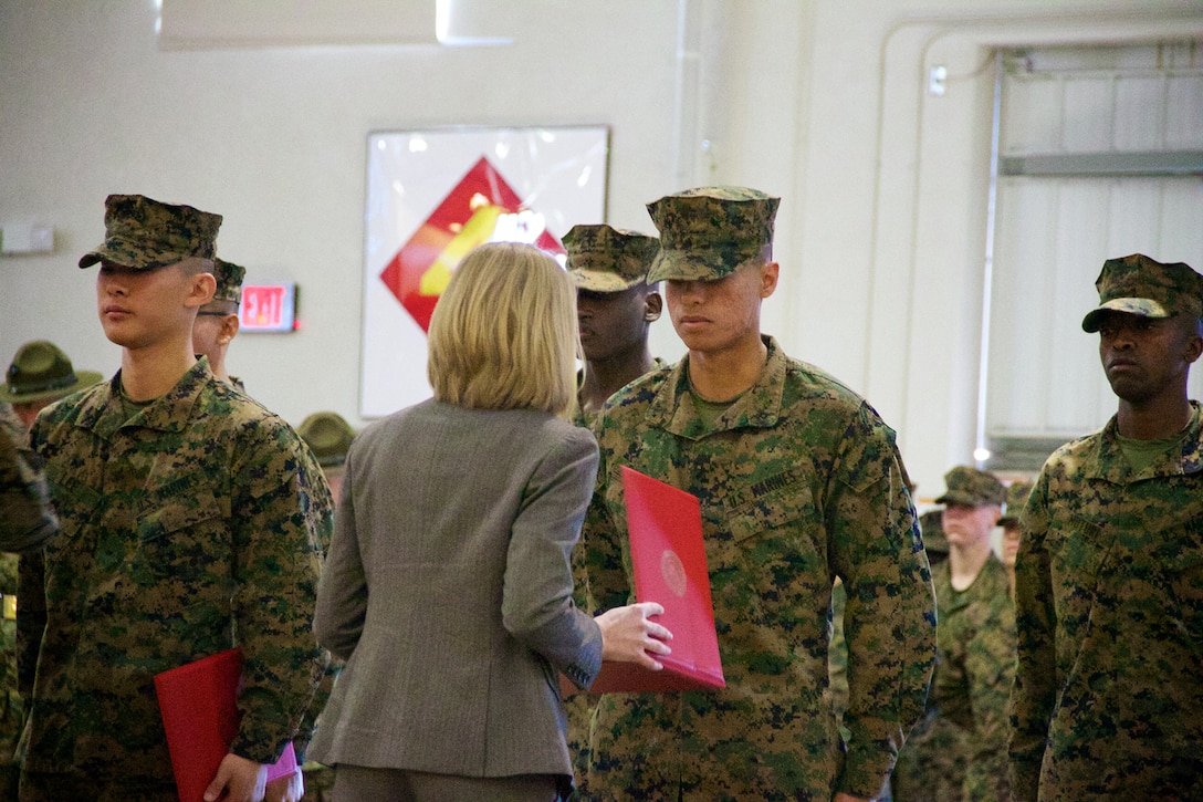 Marine Corps Pfc. Sebastian Garcia from Hialeah, Fla., earns his United States Citizenship Jan. 16, 2014 along with nine other immigrants who are graduating from recruit training on Marine Corps Recruit Depot Parris Island, S.C. The Marine Corps instituted the citizenship process at recruit training in October 2012. 