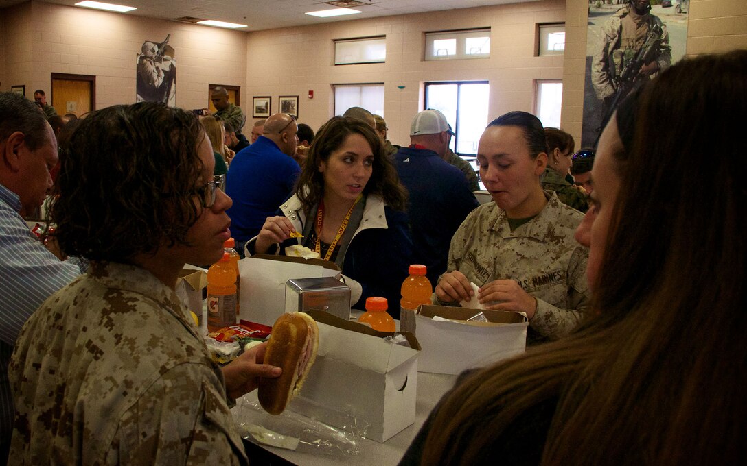 Shayna Sexton, a counselor at Wellington High School in Wellington, Fla., speaks with Marine Corps recruits during a visit to Marine Corps Recruit Depot Parris Island, S.C., Jan. 15, 2014. Each year, hundreds of high school educators participate in the Marine Corps’ Educator’s Workshop to get a deeper understanding of how the Corps makes Marines. 