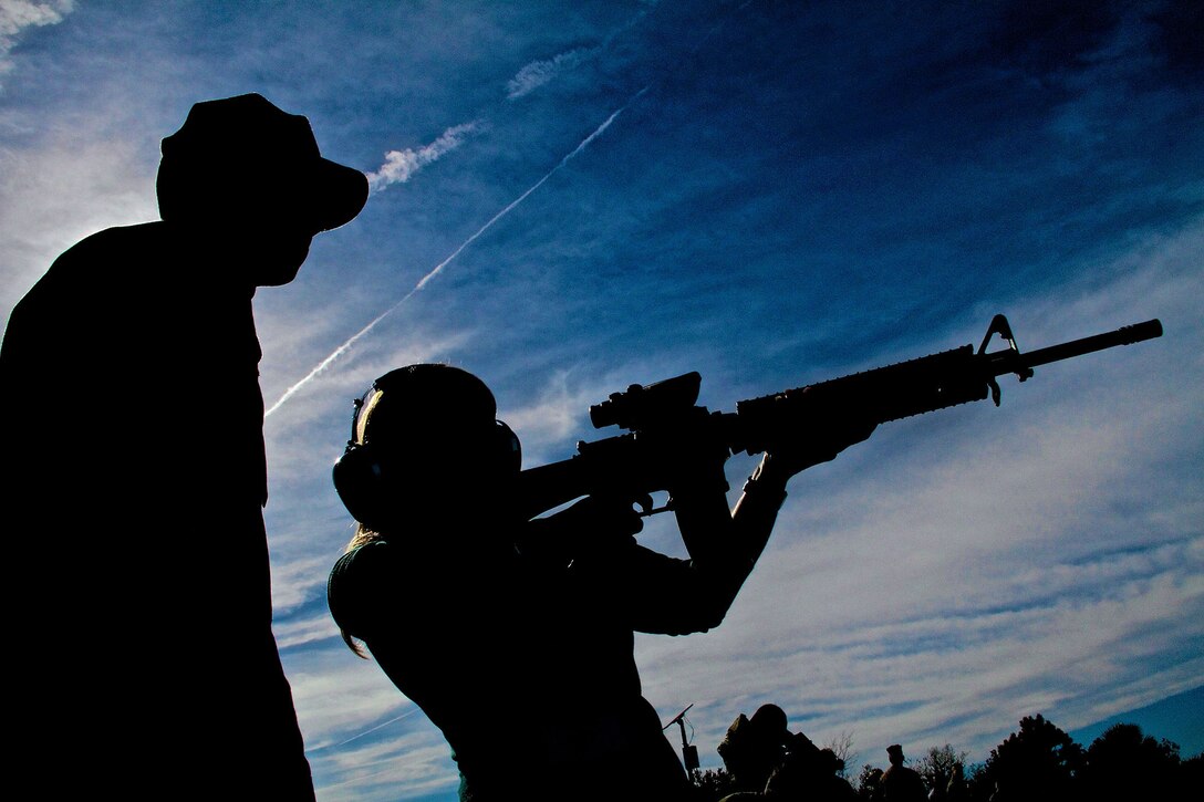 An educator participating in the Marine Corps’ Educators Workshop fires an M16A4 Carbine during a visit to Marine Corps Recruit Depot Parris Island, S.C., Jan. 15, 2014. Each year, hundreds of high school educators participate in the Marine Corps’ Educator’s Workshop to get a deeper understanding of how the Corps makes Marines. 