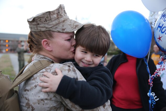 Sgt. Michelle Ven Huizen shares a moment with her son at Marine Corps Air Station Cherry Point's Chapel, Jan. 13, after returning from a seven-month deployment to Afghanistan. Ven Huizen and more than 200 Marines and Sailors deployed as part of Marine Air Control Group 28 in support of the Afghan-led military operations in southwestern Afghanistan. Ven Huizen is a meteorology and oceanography forecaster with Marine Air Control Squadron 2.
