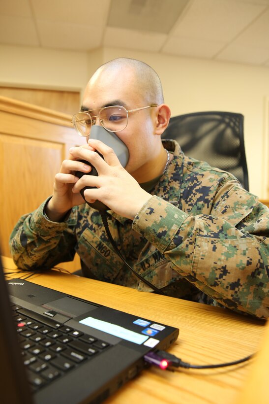 Lance Cpl. Kevin C. Ngo uses a voice writing program that allows him to transcribe everything he says to a laptop Jan. 21. Ngo is a court reporter for Headquarters and Headquarters Squadron aboard Marine Corps Air Station Cherry Point whose job is to capture and record everything that is being said during a court-martial or similar hearing.


