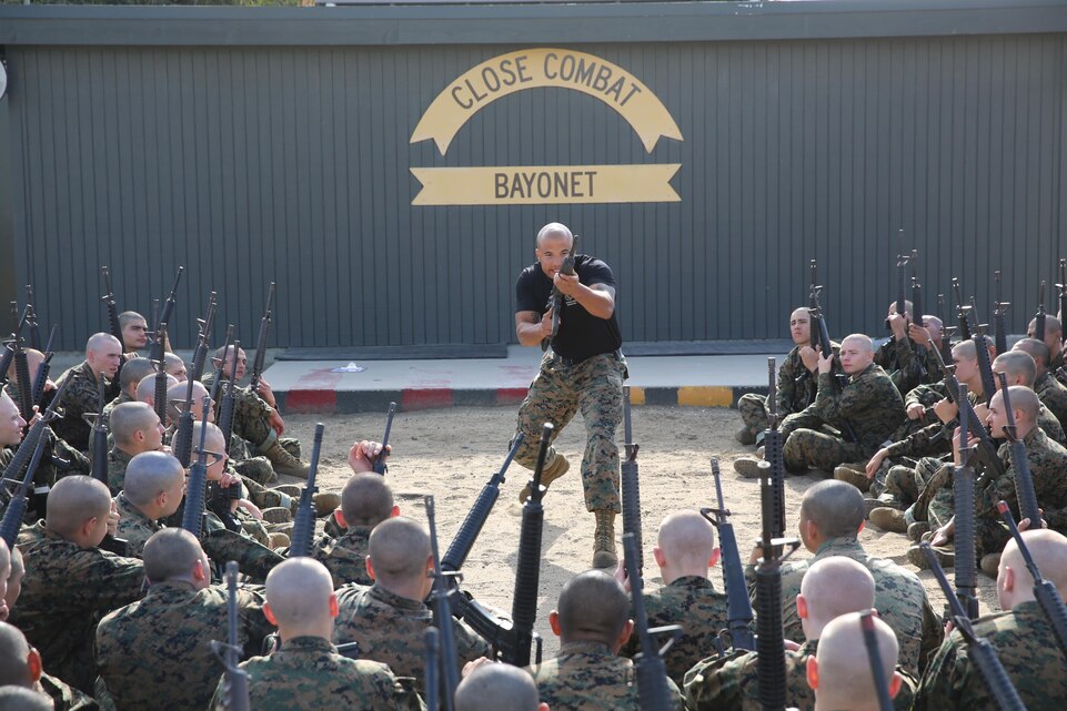 A Marine Corps Martial Arts Program instructor teaches recruits of Company I, 3rd Recruit Training Battalion, bayonet techniques before starting the BayonetAssault Course. The Marine Corps MCMAP motto is ‘one mind, any weapon.’