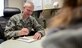 Master Sgt. Phil Ryan takes notes in his office, Jan. 17, 2014, at Joint Base Lewis-McChord, Wash. Ryan is the 62nd Airlift Wing inspector general complaint resolution superintendent and a reserve police officer with the Police Department in Yelm, Wash. In his Air Force job, Ryan often applies the investigation skills he has learned as a police officer. (U.S. Air Force photo/Tech. Sgt. Sean Tobin)