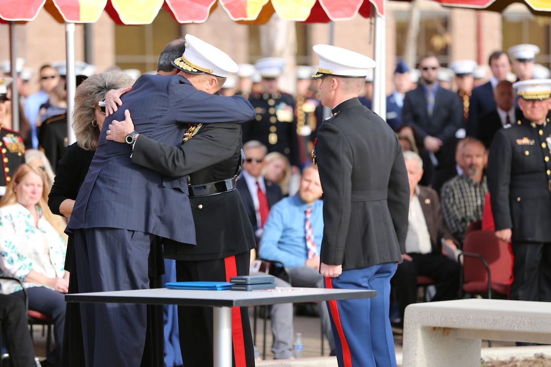 Socrates P. Manoukian, the father of Capt. Matthew P. Manoukian, embraces Maj. Gen. Mark A. Clark, the commanding general of Marine Corps Forces Special Operations Command, at a Navy Cross Ceremony aboard Camp Pendleton, Calif., Jan. 18. Manoukian was posthumously awarded the Navy Cross for actions while deployed to Afghanistan in 2012.